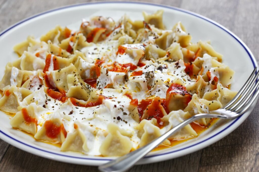 Manti in a plate with a fork Manti in a plate with a fork