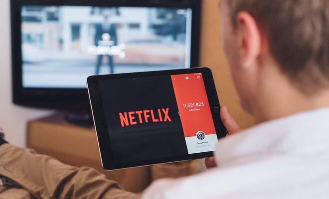 A man watching Netflix on a tablet