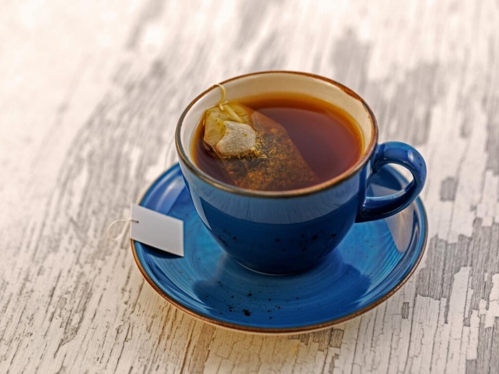 Tea in a blue sup with blue plate Tea in a blue sup with blue plate
