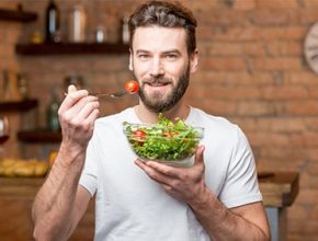 Man eating salad