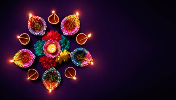 Diwali lights Colorful clay diya lamps with flowers on purple background