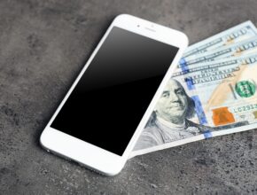 bigstock Mobile phone and money on grey 118297448 Earnity CEO Dan Schatt Explains How Mobile Payments Help Businesses