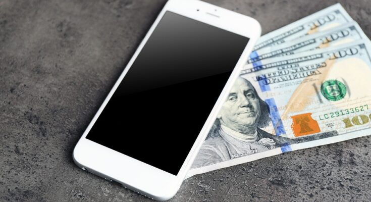 bigstock Mobile phone and money on grey 118297448 Earnity CEO Dan Schatt Explains How Mobile Payments Help Businesses